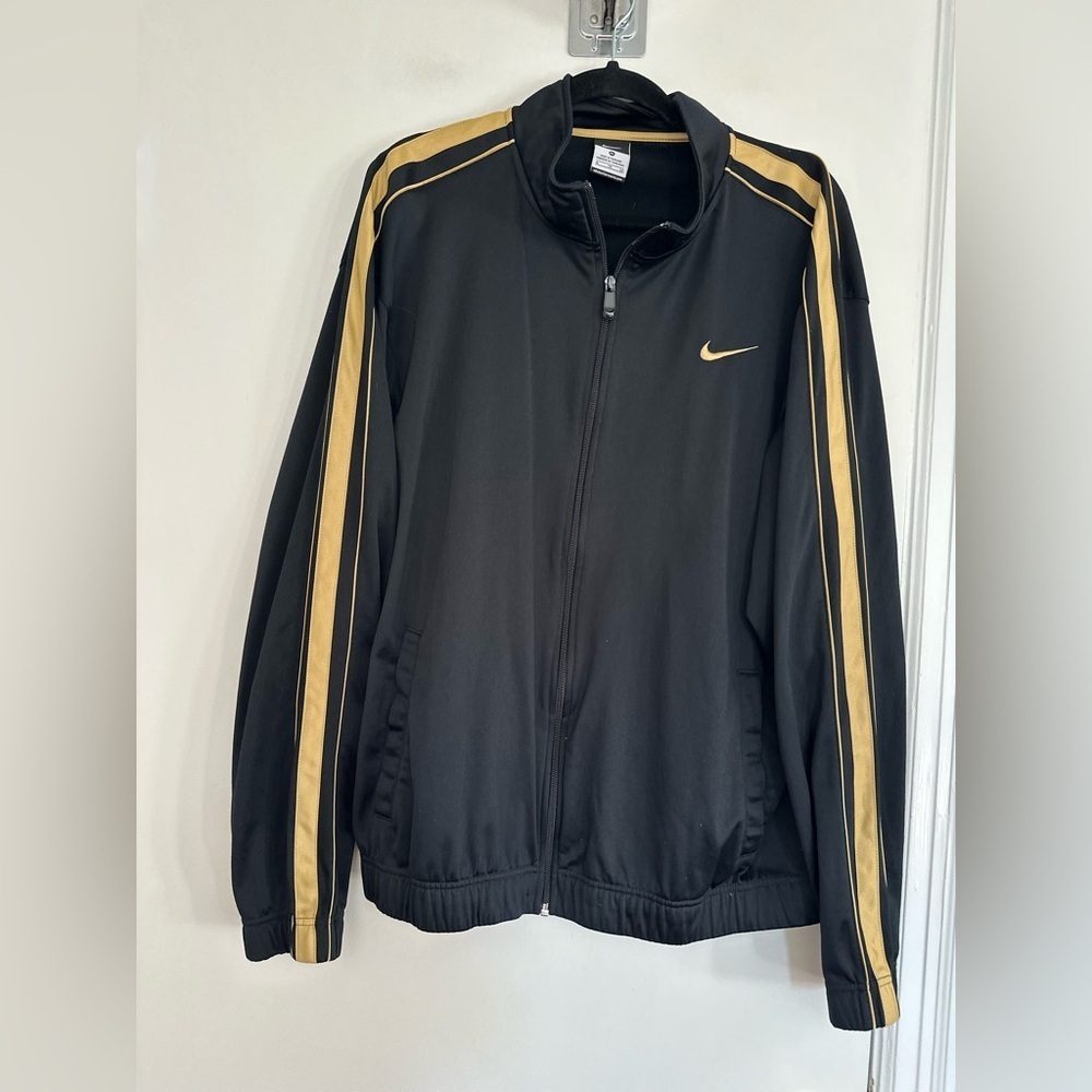 Nike Y2K black gold track jacket sleeve stripes small gold Swoosh logo. Full Zip